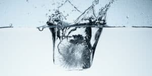 ice dropping into water